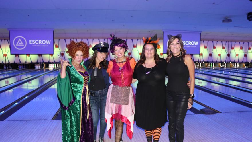 Bowling group in costume posing for a picture