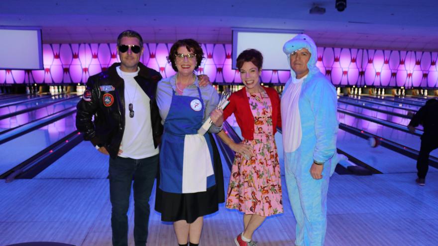 Bowling group in costume posing for a picture