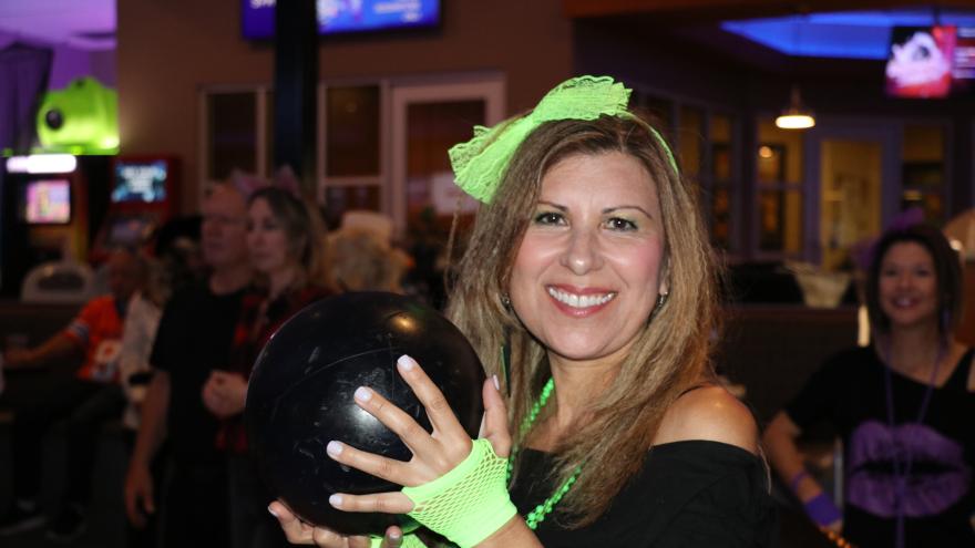 Bowler holding up bowling ball