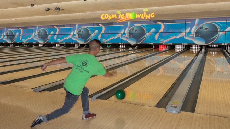 Bowler throwing a ball down a lane