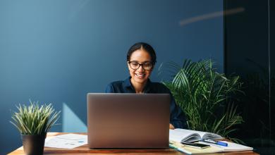 Woman smiling at laptop 